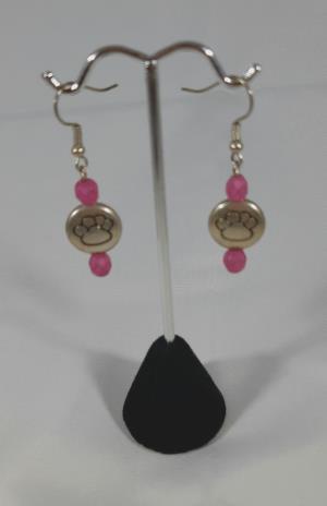 Pierced earrings, puffed paw print with pink beads